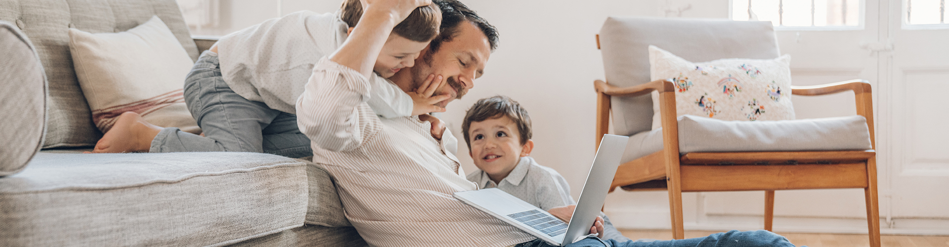 A man and a child on a couch.